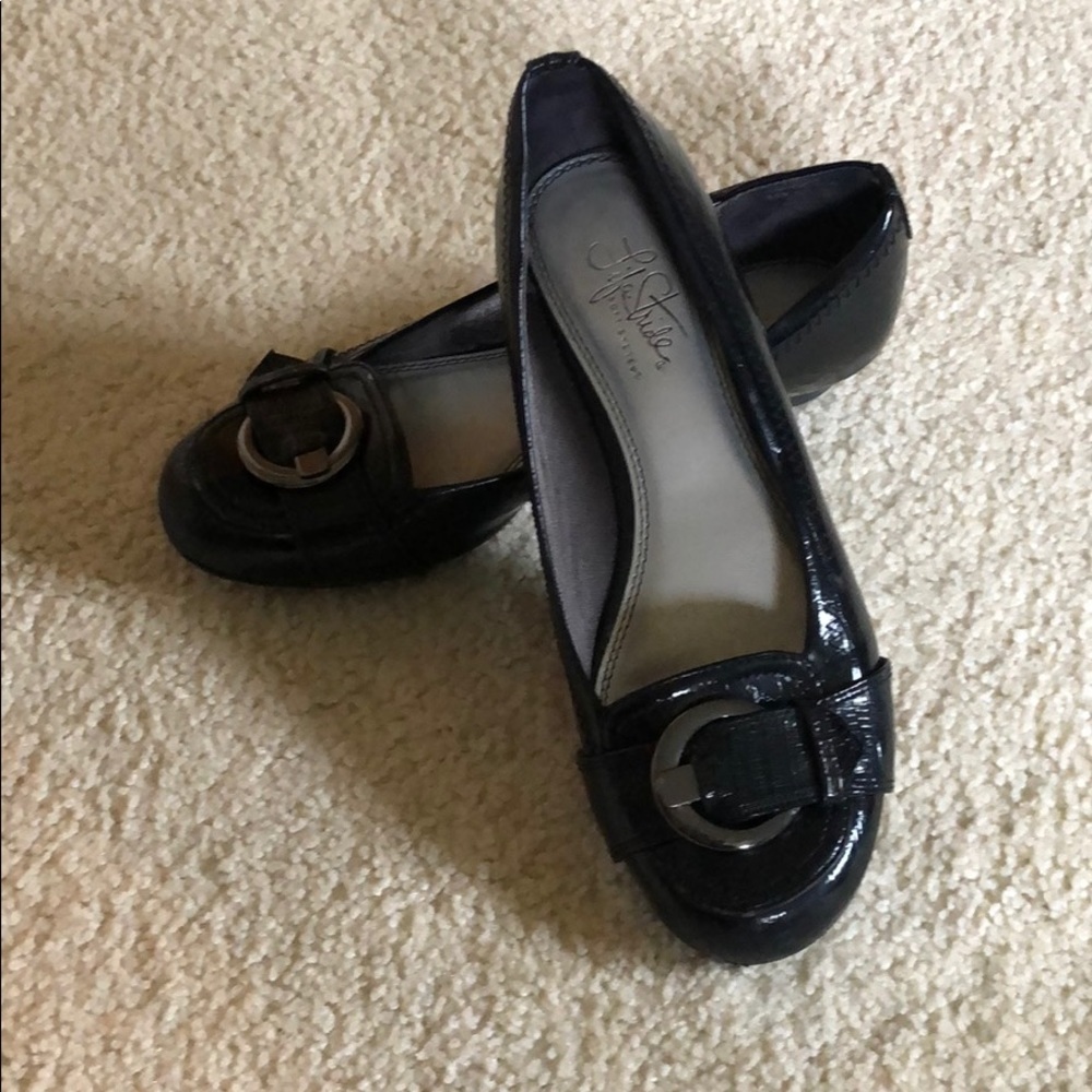 Black ballet flats with silver buckle detail